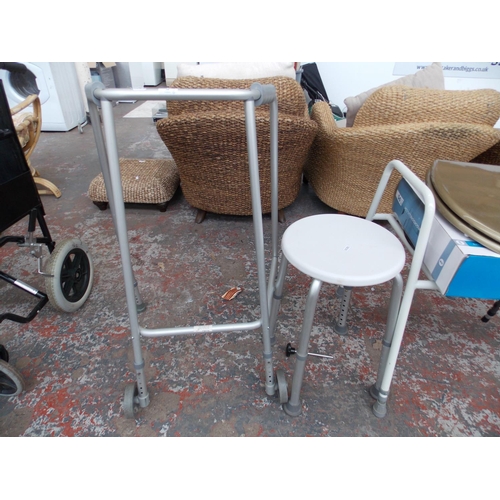 12 - SIX ITEMS OF MOBILITY EQUIPMENT TO INCLUDE WALKING AID, COMMODE CHAIR, BATH STOOL ETC