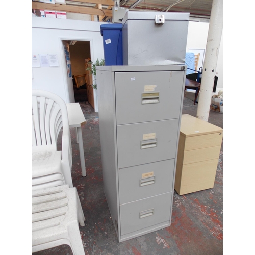 15 - THREE ITEMS TO INCLUDE A GREY METAL TRIUMPH FOUR DRAWER OFFICE FILING CABINET AND TWO FILE BOXES