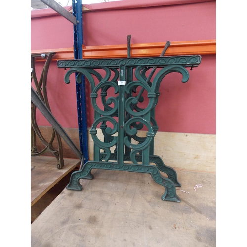 28 - A PAIR OF GREEN PAINTED CAST IRON ORNATE GARDEN TABLE LEGS