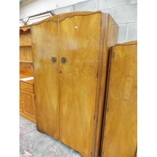 295 - A BURR WALNUT BEDROOM SUITE COMPRISING OF A DOUBLE WARDROBE, A SMALLER DOUBLE WARDROBE AND A DRESSIN... 