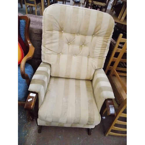 388 - A CREAM VELVET BUTTON BACKED ROCKING CHAIR