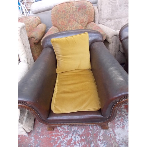 391 - A 1950'S BROWN LEATHER TWO SEATER SOFA WITH MATCHING ARM CHAIR