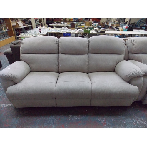 393 - A BEIGE UPHOLSTERED THREE SEATER SOFA WITH TWO MATCHING ELECTRIC RECLINING ARM CHAIRS