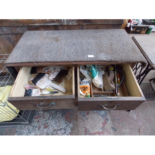 69 - A WOODEN CHEST OF FOUR DRAWERS WITH CONTAINING PAINT BRUSHES ETC