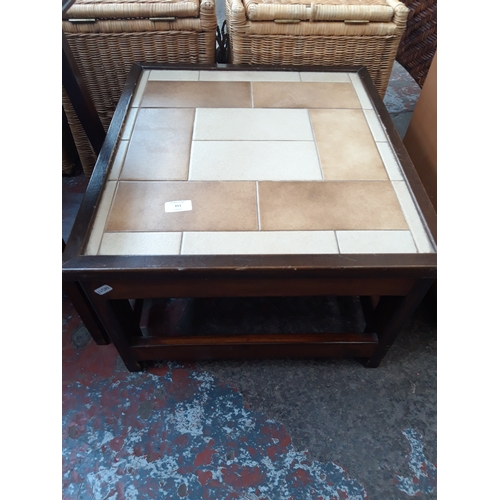 351 - A SMALL GOLDEN OAK TABLE AND A SMALL TILED TOP TABLE