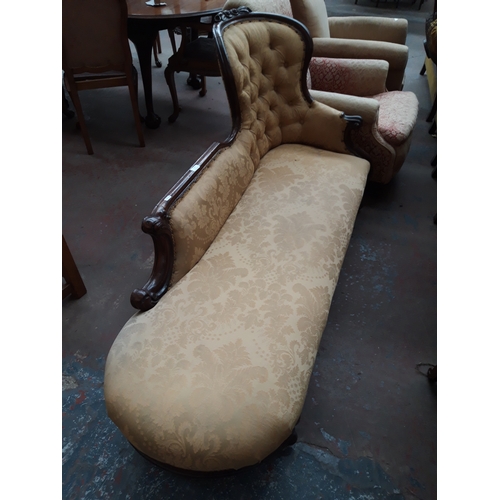 1228 - A VICTORIAN MAHOGANY FRAMED CHAISE LONGUE WITH CREAM FLORAL UPHOLSTERY, CARVED BALL AND CLAW FEET AN... 