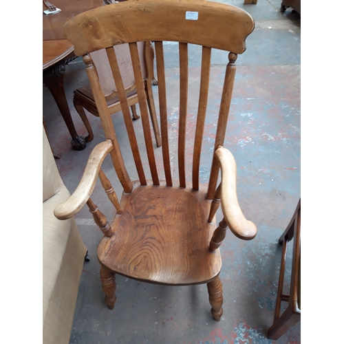 1231 - AN EARLY 20TH CENTURY ELM FARMHOUSE HALL CHAIR