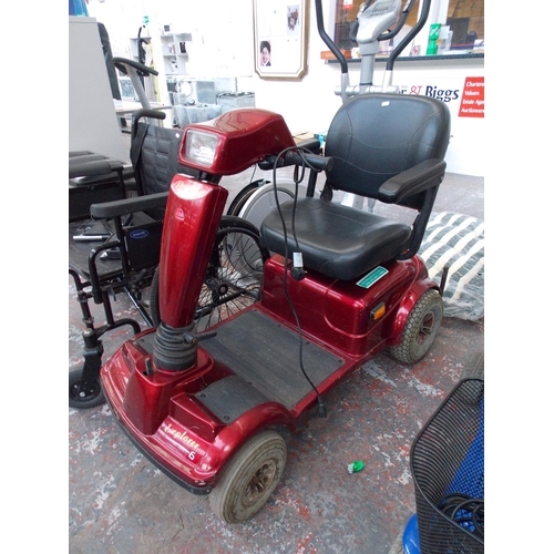 18 - A RED PRESTIGE EXPLORER 6 FOUR WHEELED MOBILITY SCOOTER WITH LIGHTS (KEYS IN OFFICE)