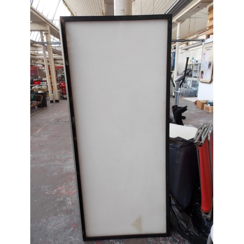 23 - A LARGE RECTANGULAR NOTICE BOARD MEASURING APPROX 6' X 2'