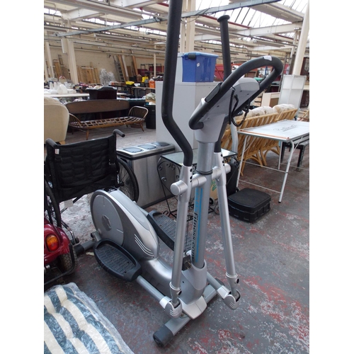 27 - A GREY STAFFS FITNESS CROSS TRAINING MACHINE WITH DIGITAL READOUT (W/O)