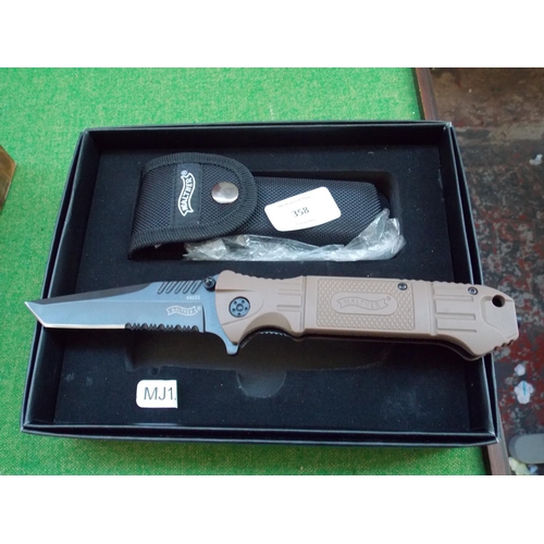 358 - A CASED WALTHER LOCKING KNIFE