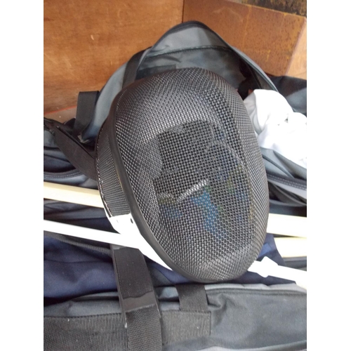 51 - A BAG CONTAINING FENCING EQUIPMENT TO INCLUDE HELMET, JACKET, WOODEN SAMURAI STYLE SWORDS, LEON PAUL... 