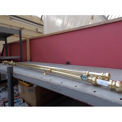 56 - THREE BRASS CURTAIN POLES