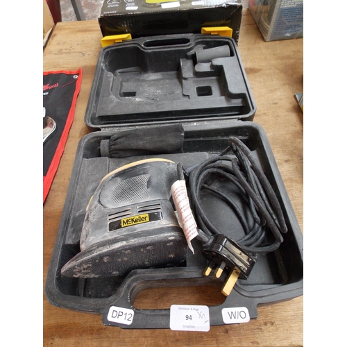 94 - TWO ITEMS TO INCLUDE A CASED MCKELLAR MCKM 16 ELECTRIC DETAIL SANDER AND A BOXED GILD ELECTRIC FLATB... 