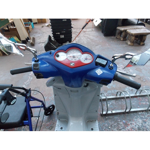 10 - A BLUE AND GREY 2003 HONDA 125CC SCOOTER WITH 13810 MILES, THREE PREVIOUS OWNERS, MOT 18/9/19 AND IN... 