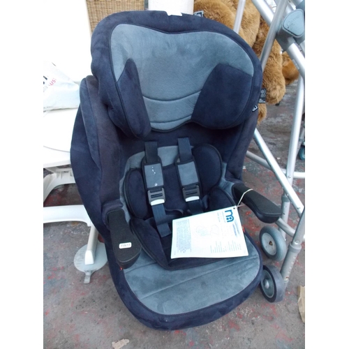 12 - A BLUE AND GREY MOTHERCARE CHILD'S CAR SEAT WITH INSTRUCTION MANUAL