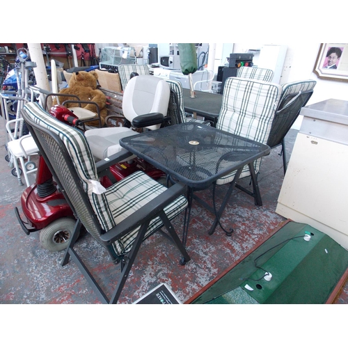 18 - A THREE PIECE BLACK METAL CONSERVATORY SET COMPRISING OF SQUARE TABLE AND TWO ARMCHAIRS WITH TARTAN ... 