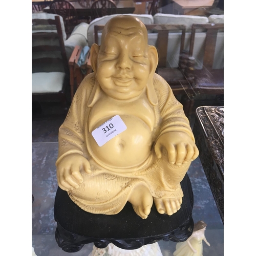 310 - A LARGE RESIN BUDDHA FIGURE