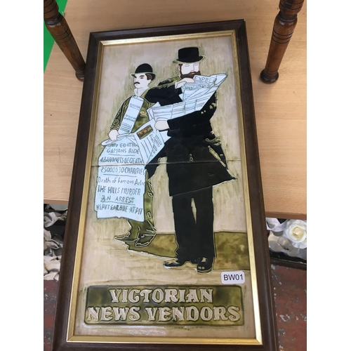 369 - A FRAMED TILED PLAQUE OF VICTORIAN NEWS VENDORS AND A MAHOGANY READING TABLE