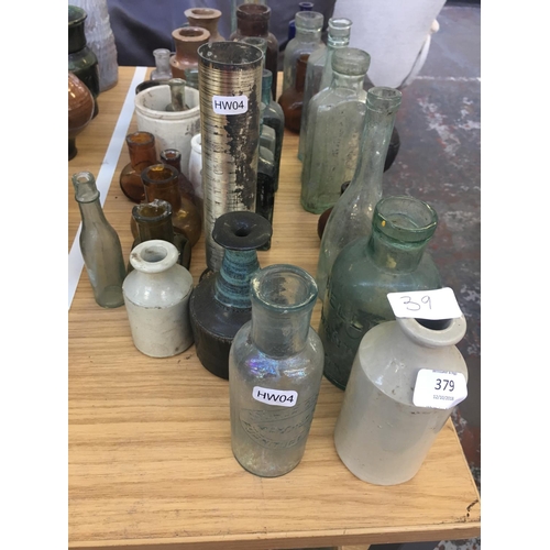 379 - THIRTY NINE VINTAGE GLASS BOTTLES