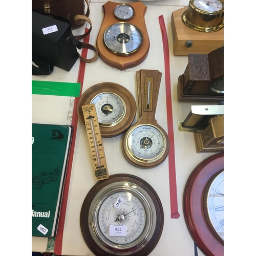 411 - FOUR VARIOUS BAROMETERS AND A 1963 RAILWAY THERMOMETER