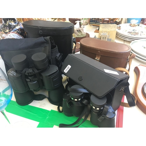 413 - FOUR CASED SETS OF BINOCULARS TO INCLUDE A SET OF 8 X 30, TWO SETS OF 10 X 50 ETC