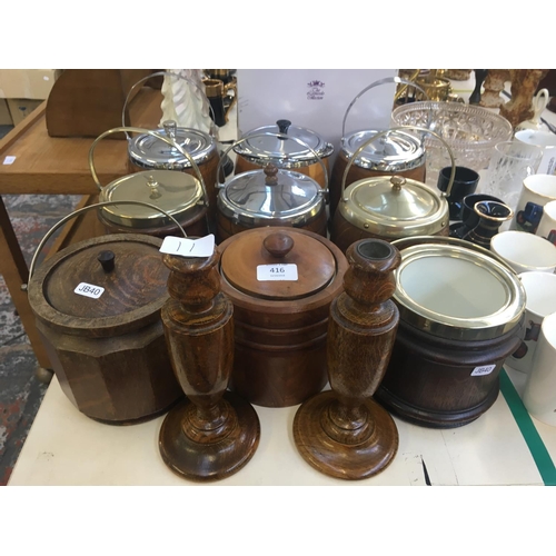 416 - ELEVEN ITEMS TO INCLUDE NINE VINTAGE WOODEN BISCUIT BARRELS AND TWO WOODEN CANDLESTICKS