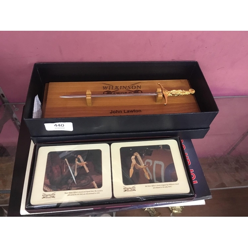 440 - A BOXED WILKINSON SWORD MINIATURE SWORD TOGETHER WITH COASTERS AND BOOKS