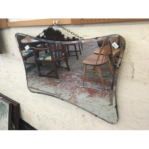 492 - A VINTAGE 1950'S BEVEL EDGED MIRROR