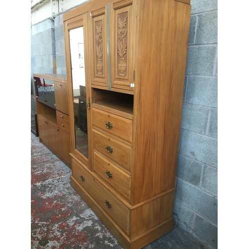 520 - AN EDWARDIAN SATINWOOD COMPACTUM WARDROBE WITH A MIRRORED DOOR, TWO UPPER CARVED DOORS, THREE SMALL ... 