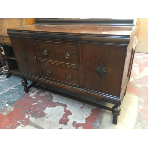 539 - A VINTAGE 1930'S DARK OAK SIDEBOARD WITH TWO DOORS AND TWO DRAWERS