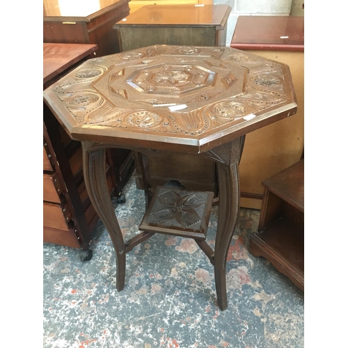 547 - A HEAVILY CARVED MAHOGANY OCCASIONAL TABLE