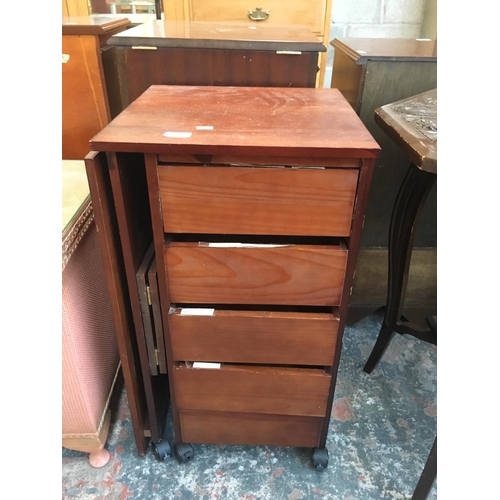 548 - A TEAK CHEST OF FIVE DRAWERS ON CASTERS