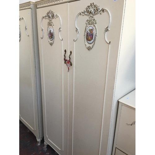 554 - A FIVE PIECE FRENCH STYLE CREAM BEDROOM SUITE COMPRISING OF TWO DOUBLE WARDROBES, CHEST OF FIVE DRAW... 