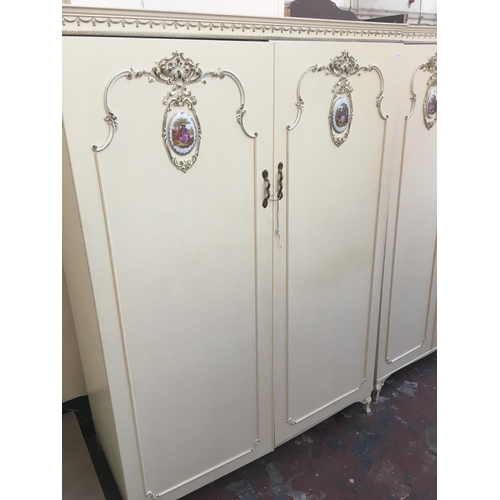 554 - A FIVE PIECE FRENCH STYLE CREAM BEDROOM SUITE COMPRISING OF TWO DOUBLE WARDROBES, CHEST OF FIVE DRAW... 