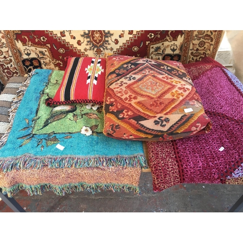 559 - FIVE ITEMS TO INCLUDE A CARPET, TWO THROWS AND TWO CUSHIONS