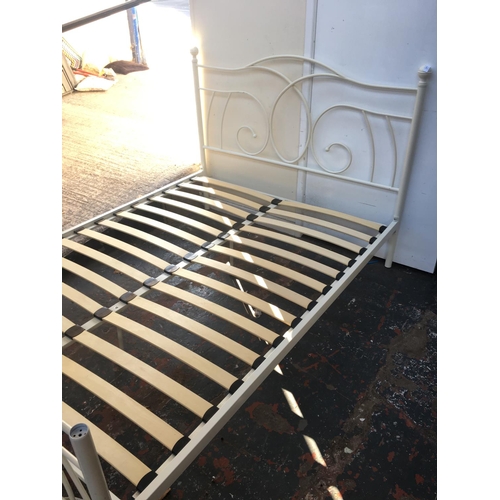 563 - A WHITE METAL DOUBLE BED FRAME