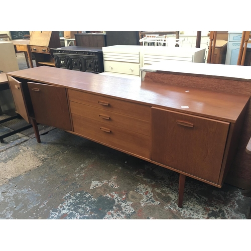 570 - A RETRO AVALON TEAK SIDEBOARD WITH THREE DOORS AND THREE DRAWERS