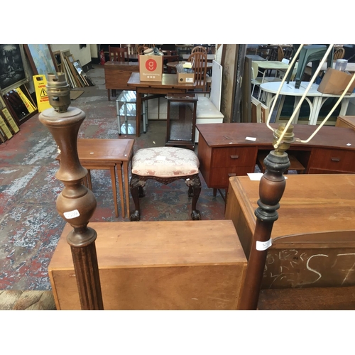 577 - TWO WOODEN STANDARD LAMPS TO INCLUDE ONE MAHOGANY AND ONE OAK