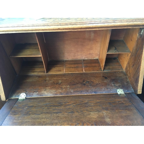 595 - AN OAK LADIES BUREAU WITH ONE DRAWER, TWO SHELVES AND A FALL FRONT