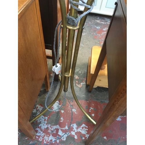 604 - A VINTAGE BRASS RISE AND FALL STANDARD LAMP