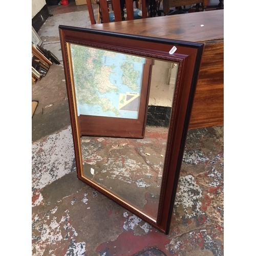 498 - A MAHOGANY FRAMED BEVEL EDGED MIRROR