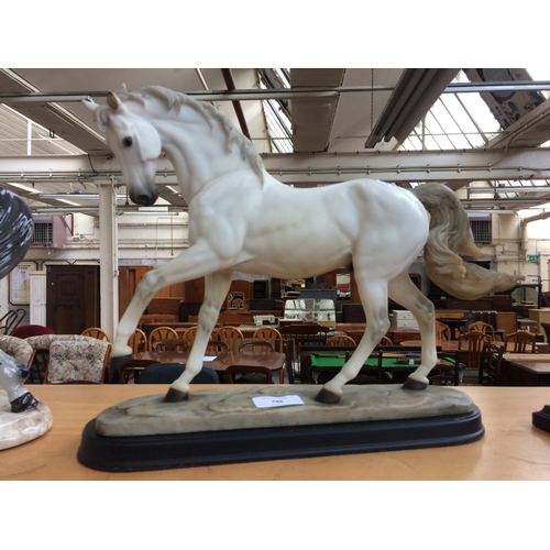 361 - A COMPOSITE WHITE HORSE FIGURINE