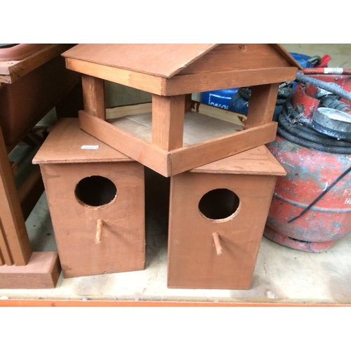 50 - SIX ITEMS TO INCLUDE TWO WOODEN BIRD BOXES, A BIRD TABLE, TWO RECTANGULAR GARDEN PLANTERS AND A PAIR... 