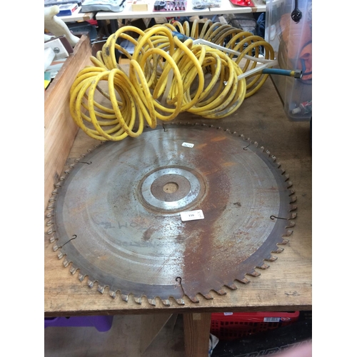 116 - TWO ITEMS TO INCLUDE A 17 INCH CIRCULAR SAW BLADE AND A YELLOW AIRLINE PIPE WITH ATTACHMENT