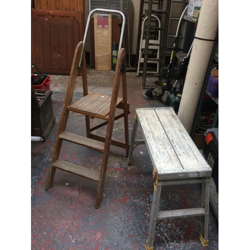 80 - TWO ITEMS TO INCLUDE A YOUNGMAN ALUMINIUM WORK STEP AND A SET OF THREE STEP WOODEN STEP LADDERS