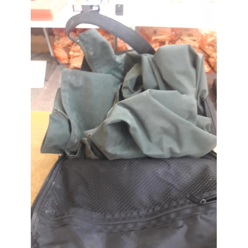 103 - A BLACK BAG CONTAINING TWO FLEXOTHANE WATERPROOF JACKETS