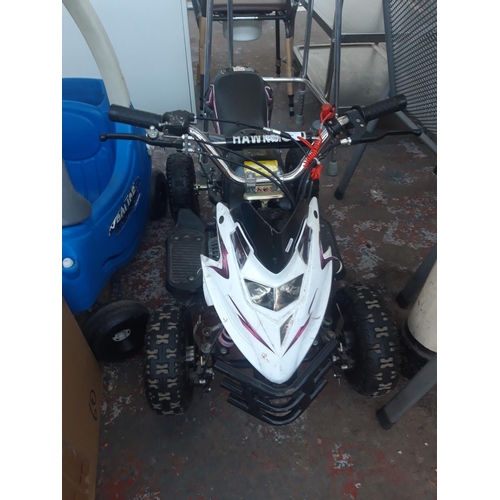 19 - A BLACK AND WHITE CHILD'S RIDE ON TWO STROKE QUAD BIKE WITH INDEPENDENT FRONT AND MONOSHOCK REAR SUS... 