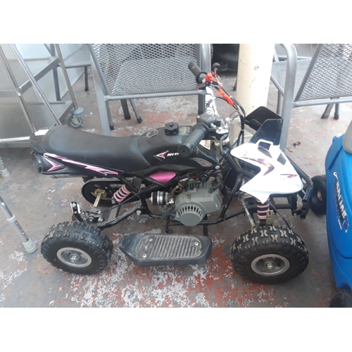 19 - A BLACK AND WHITE CHILD'S RIDE ON TWO STROKE QUAD BIKE WITH INDEPENDENT FRONT AND MONOSHOCK REAR SUS... 