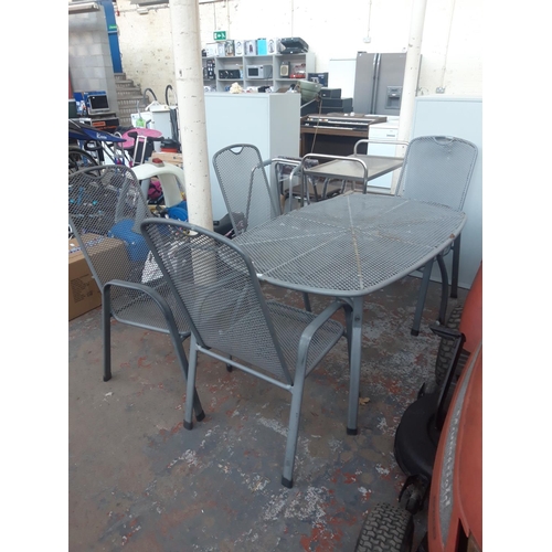 20 - A FIVE PIECE GREY PAINTED MESHED METAL PATIO SET TO INCLUDE OVAL TABLE AND FOUR MATCHING ARMCHAIRS